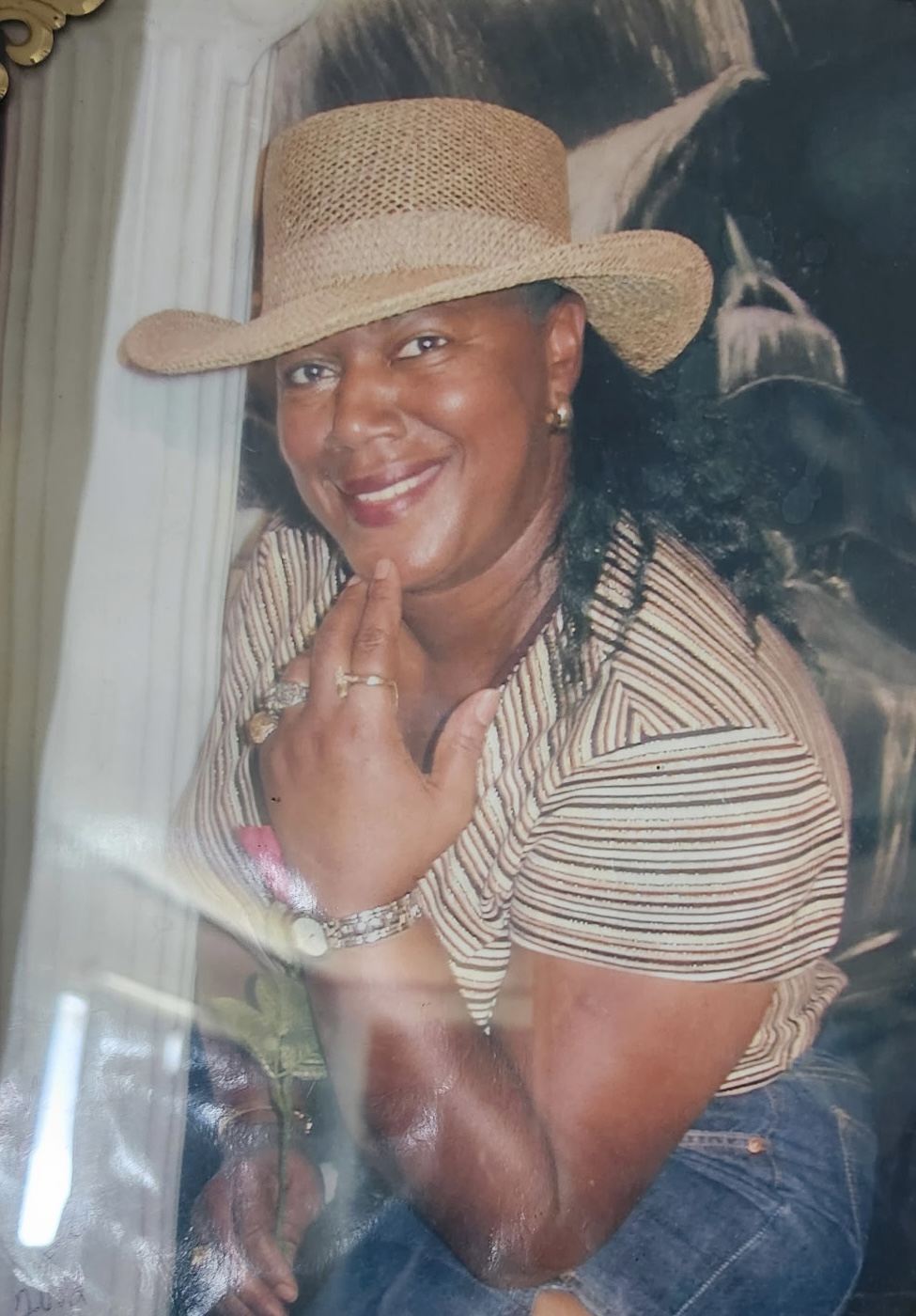 Gwen Moye smiling in a hat